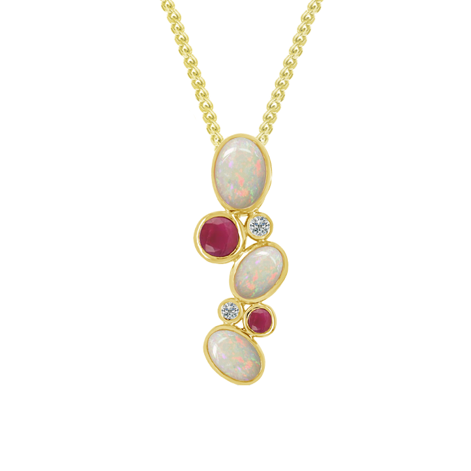 Gold necklace with opal and ruby pendant on a white background