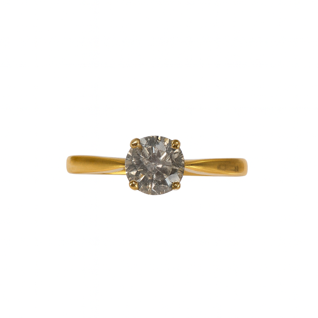 Gold ring with a diamond on a white background
