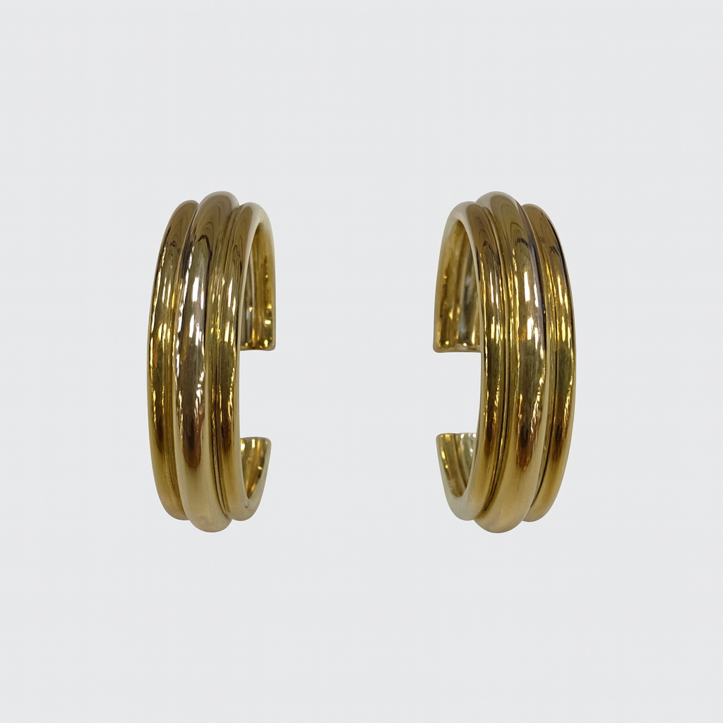Pair of gold hoop earrings on a white background