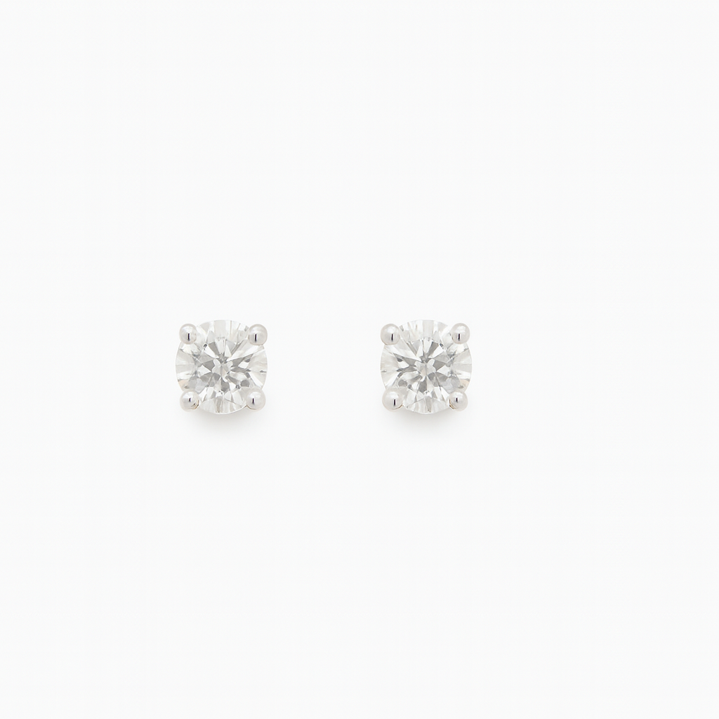 Pair of diamond stud earrings qualified gemmologist