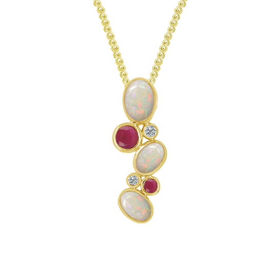 Gold necklace with opal and ruby pendant on a white background