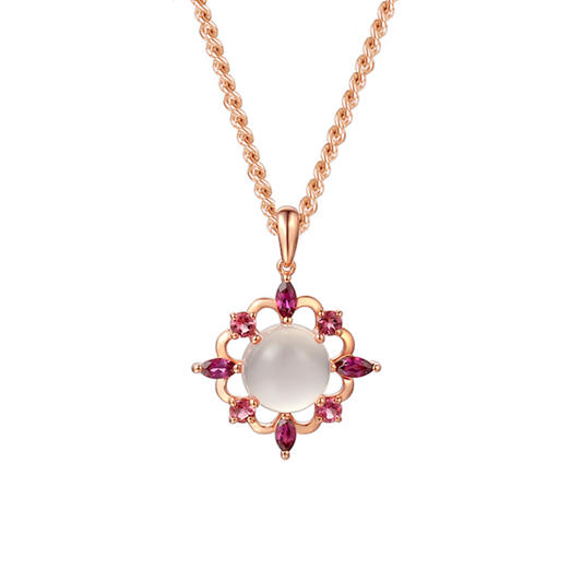 Rose gold necklace with a pendant featuring a central gemstone and smaller stones on a white background