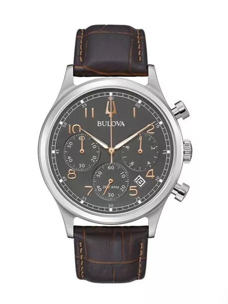 Bulova watch with brown leather strap on a white background