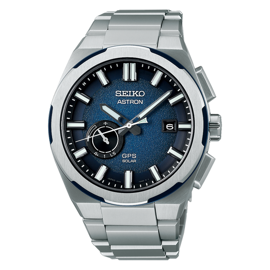 Seiko Astron watch with blue face and silver metal strap on a white background
